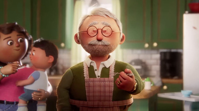 a man with glasses and a beard standing in a kitchen