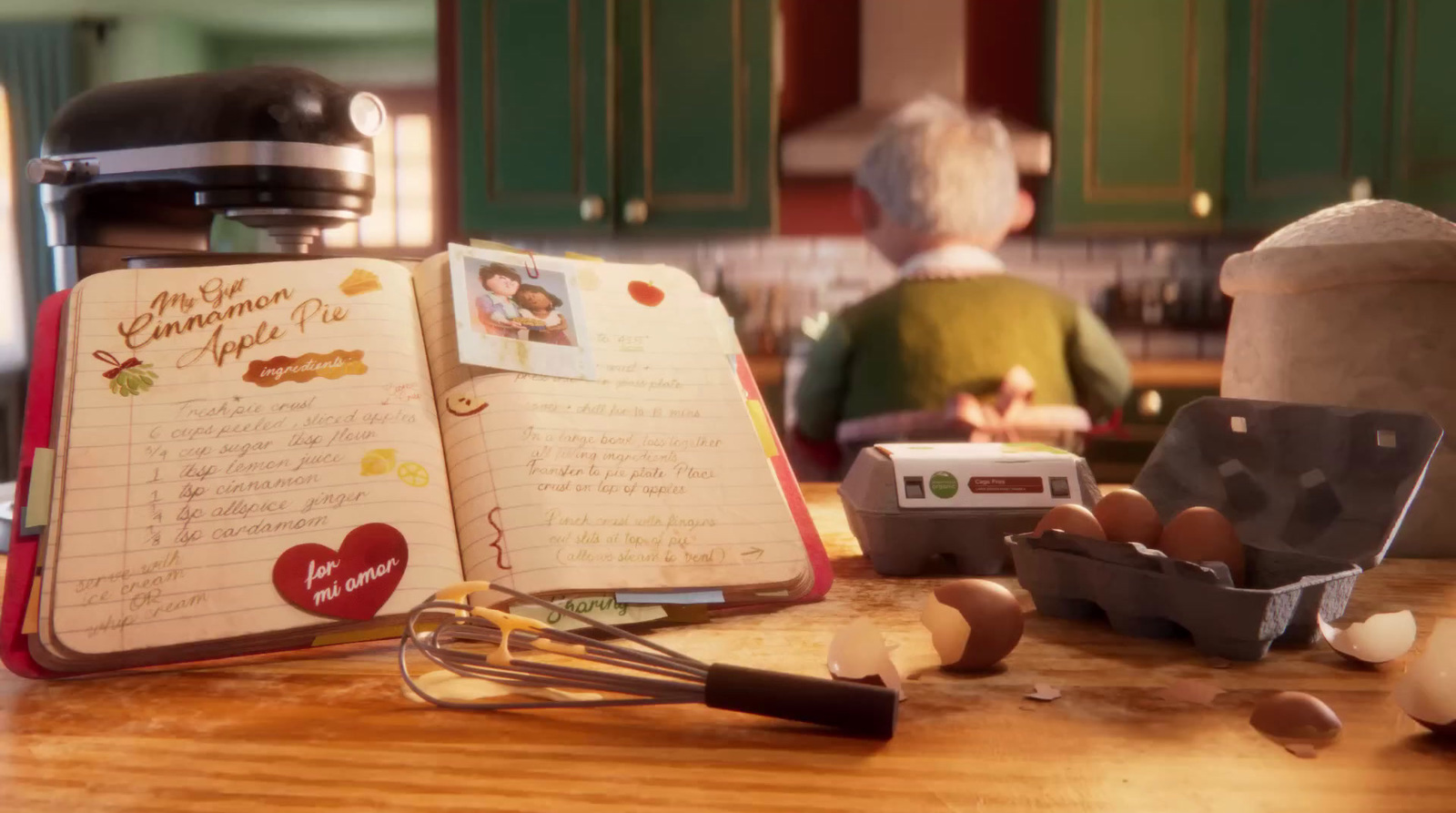 an open recipe book sitting on top of a wooden table