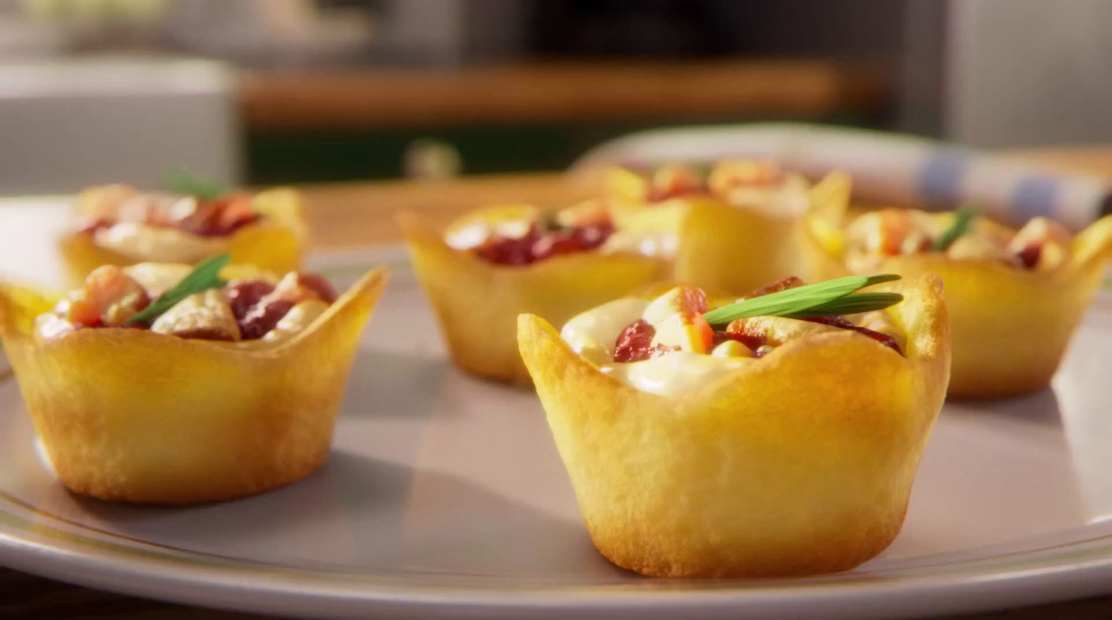 a white plate topped with mini cups filled with food