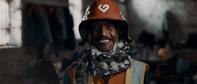 a man wearing a fireman's helmet and scarf