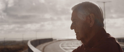 a man standing on the side of a road