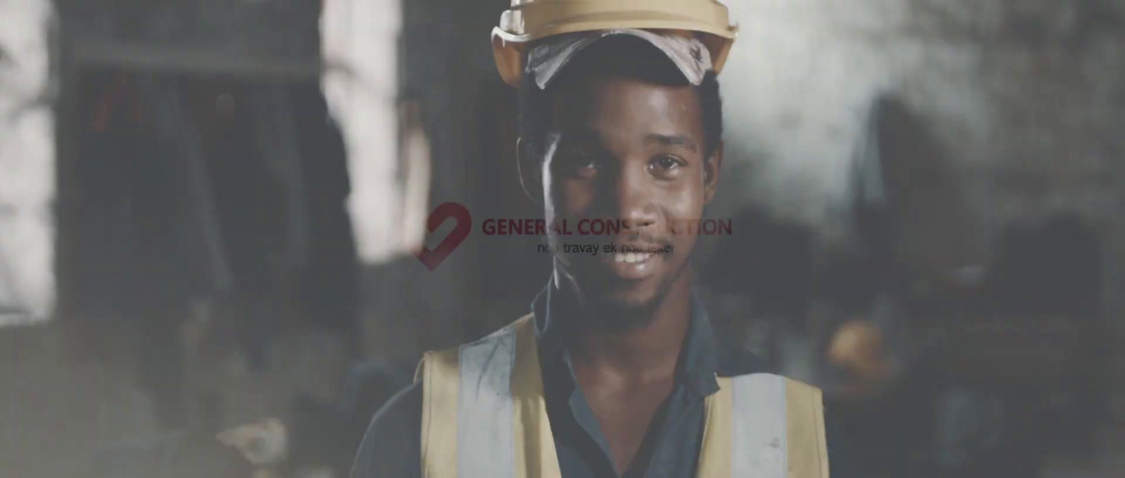 a man wearing a safety vest and a hard hat