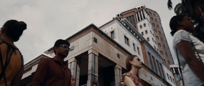 a group of people standing in front of a building