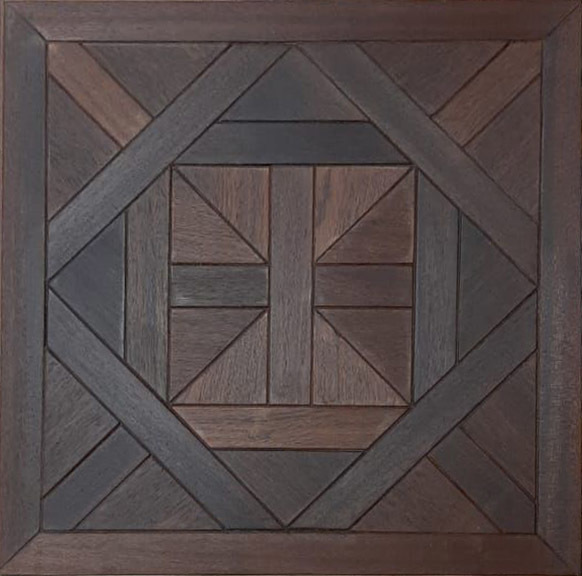 a wooden wall hanging with a square design on it