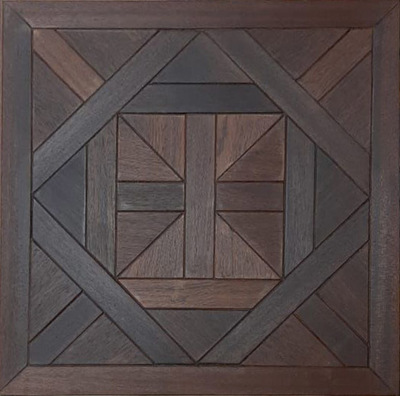 a wooden wall hanging with a square design on it