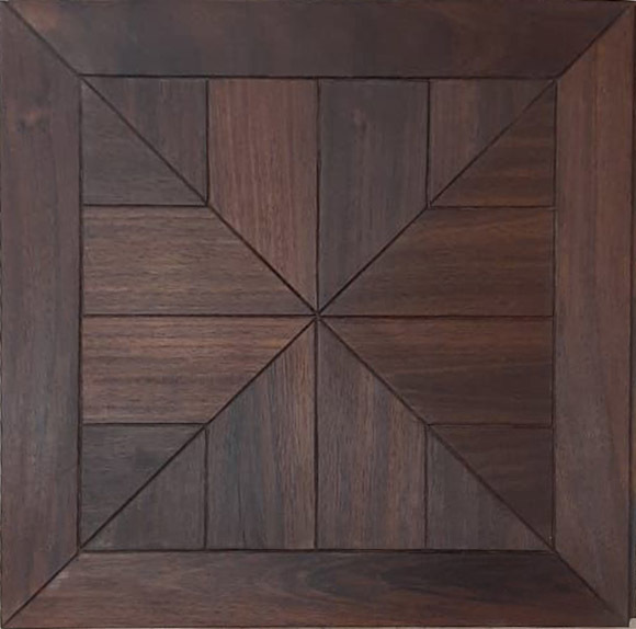 a wooden box with a square design on it