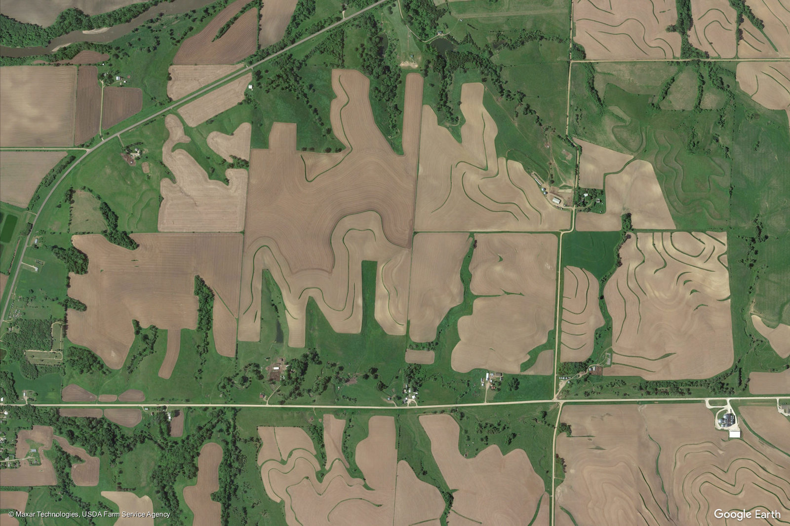 an aerial view of a green and brown field