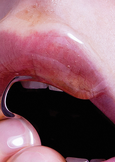 a close up of a person holding a piece of metal