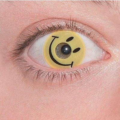 a close up of a person's eye with a smiley face painted on it