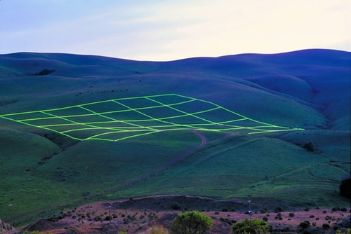 a picture of a green box in the middle of a field