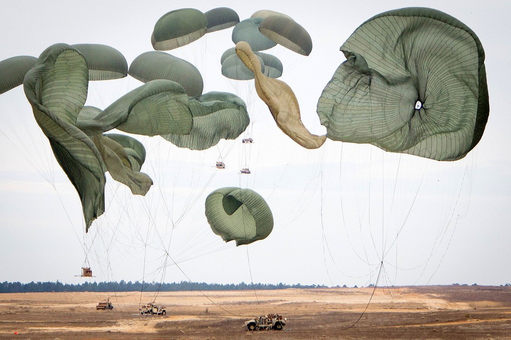 a group of large kites flying in the sky