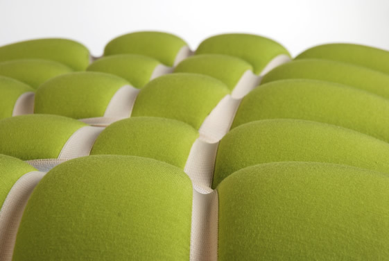 a close up of a row of green seats