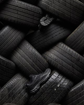 a pile of black tires stacked on top of each other