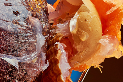 a close up of a doughnut covered in plastic wrap