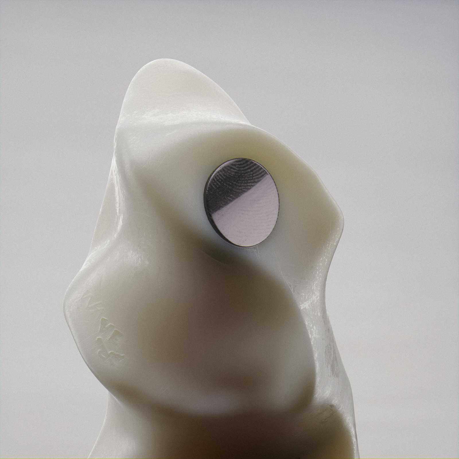 a close up of a white sculpture with a hole in it