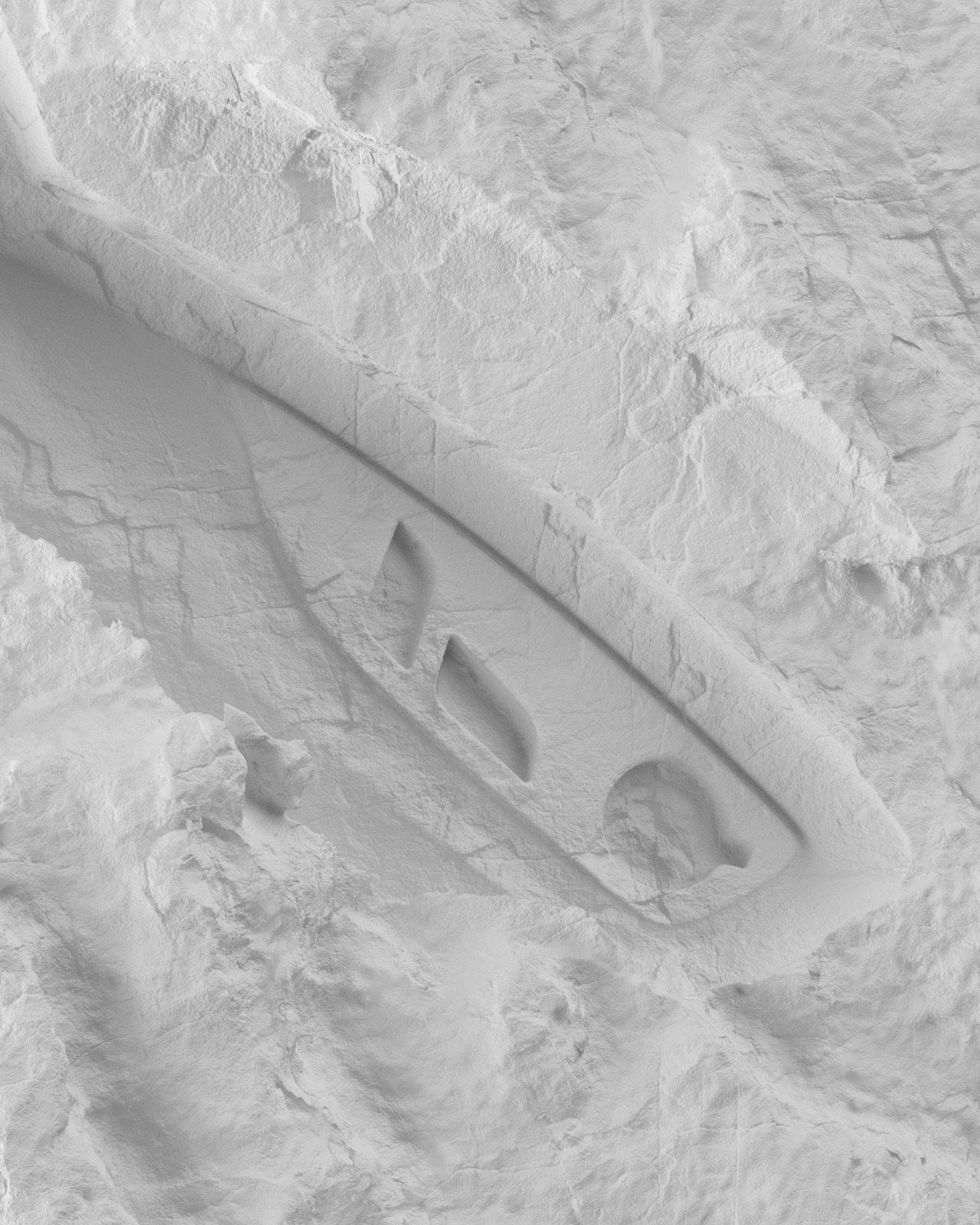 a white surfboard laying on top of snow covered ground