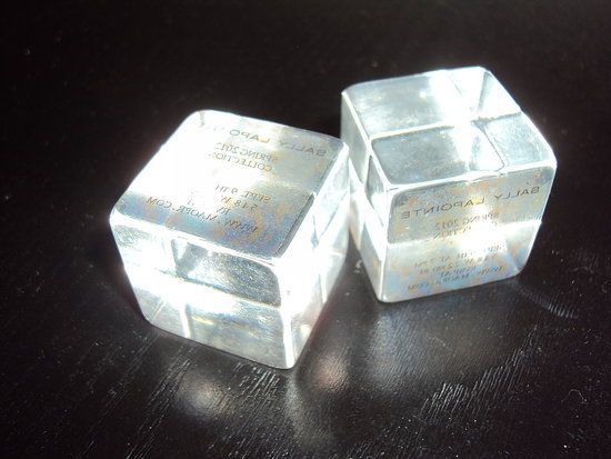 a couple of silver cubes sitting on top of a table