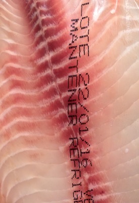 a close up of a piece of meat with chinese writing on it