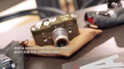 a camera sitting on top of a wooden table