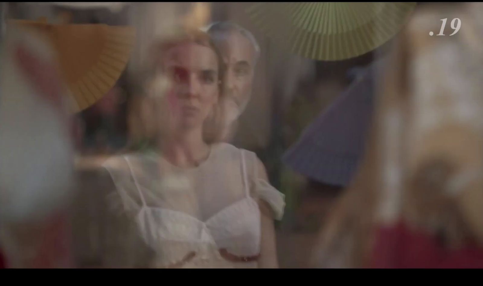 a blurry photo of a woman in a white dress