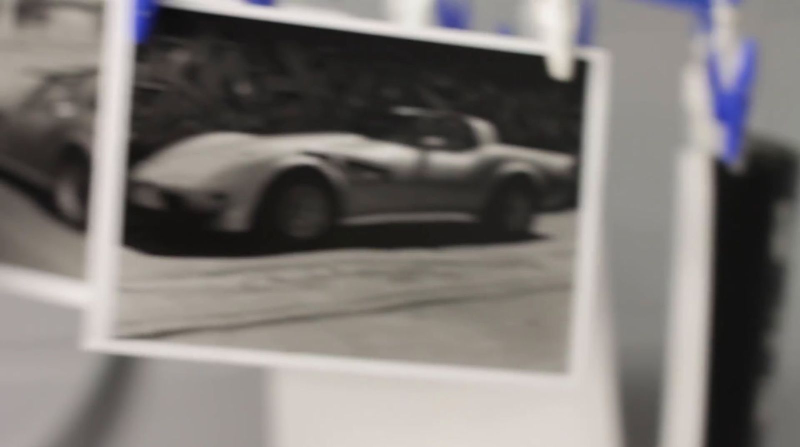 a black and white photo of a car on a street