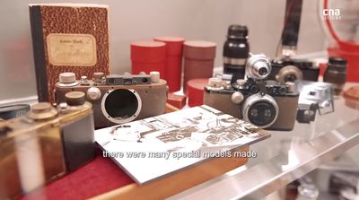 a bunch of old cameras sitting on a table