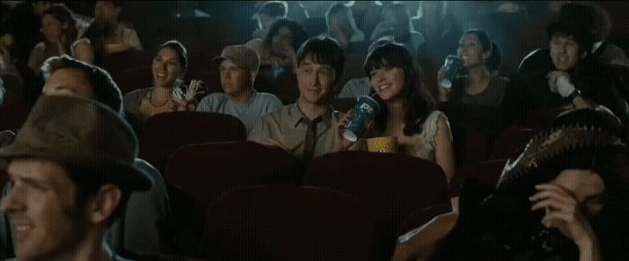 a group of people sitting in a movie theater