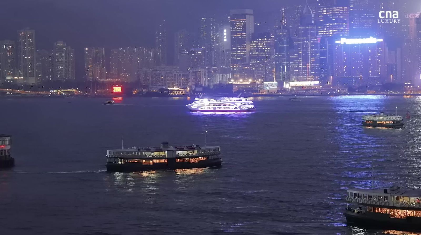 a group of boats floating on top of a large body of water