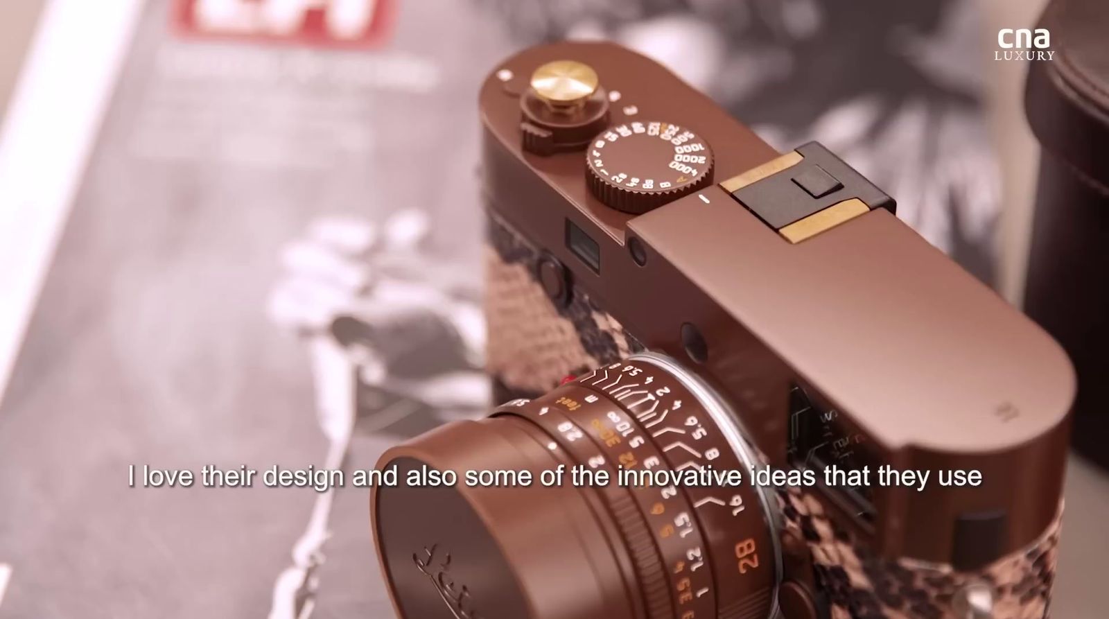 a brown camera sitting on top of a table