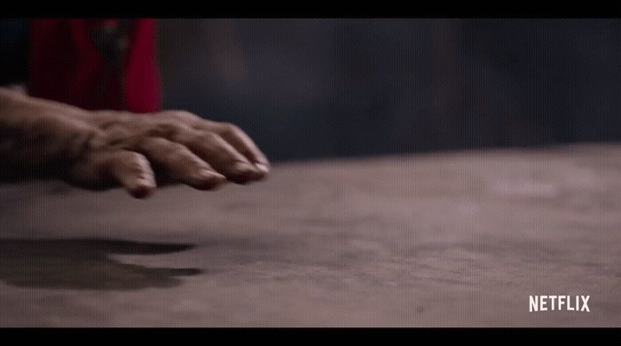 a close up of a person's hand on a table