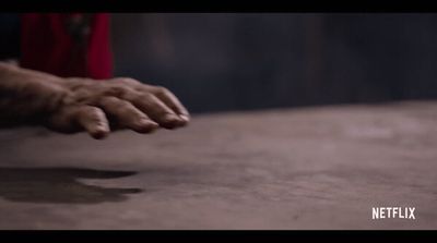 a close up of a person's hand on a table