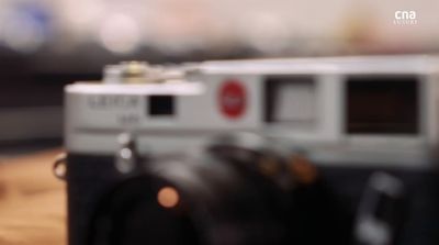 a camera sitting on top of a wooden table