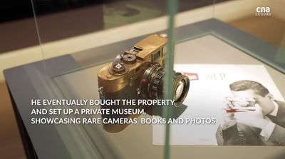 a picture of a camera on display in a glass case