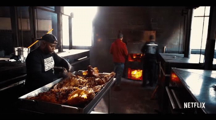 a man standing in a kitchen preparing food