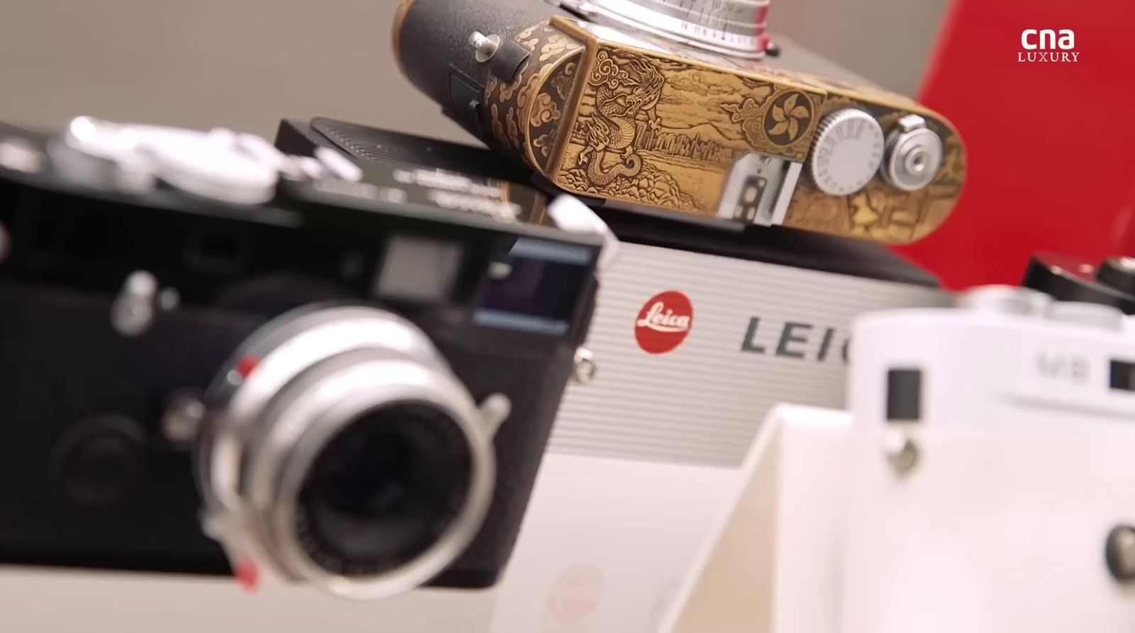 a couple of cameras sitting on top of a table