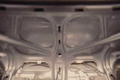 the inside of a car with the hood up