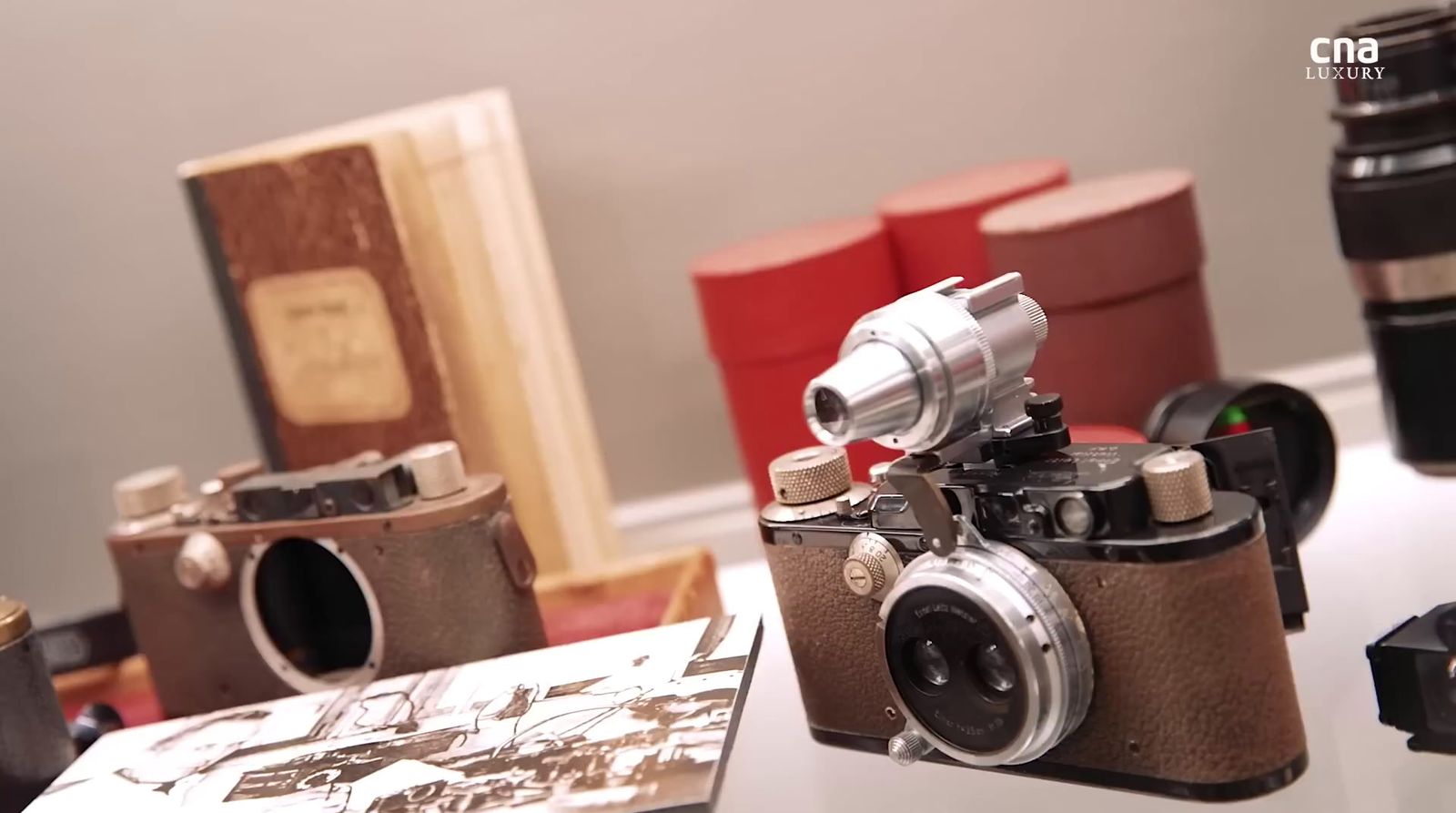 a couple of cameras sitting on top of a table