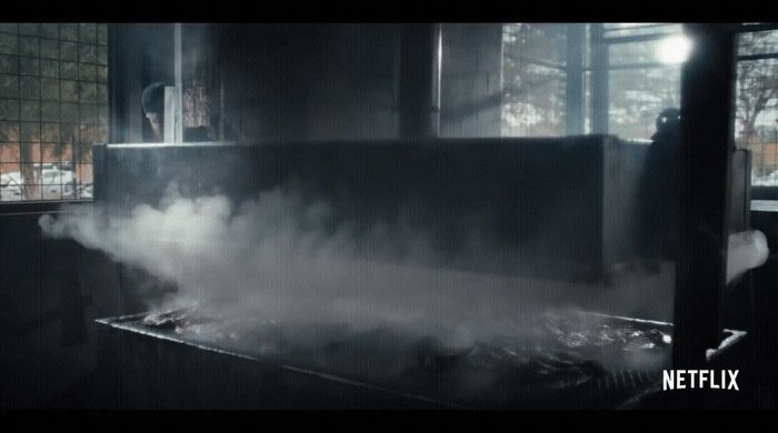 smoke coming out of a stove in a kitchen