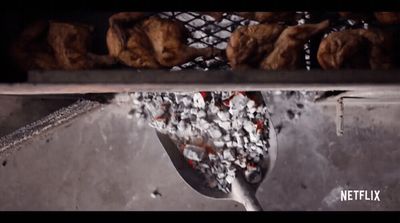 a spoon full of food sitting on top of a counter