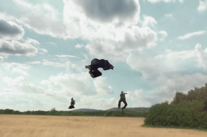 two people are flying a kite in a field