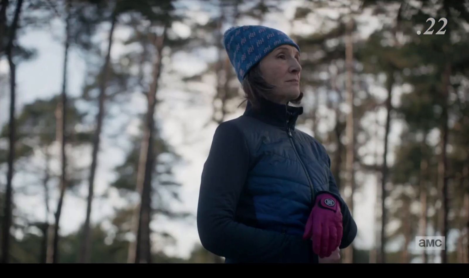 a woman wearing a blue hat and gloves