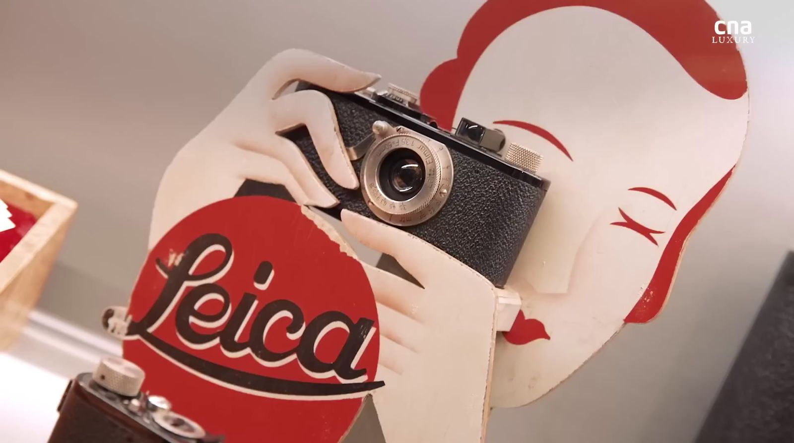 a close up of a person holding a camera