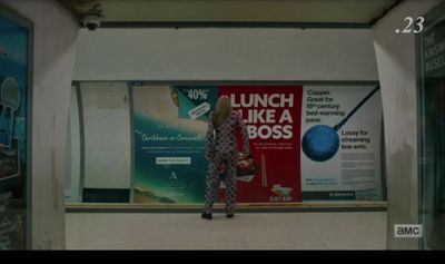 a woman standing in front of a poster