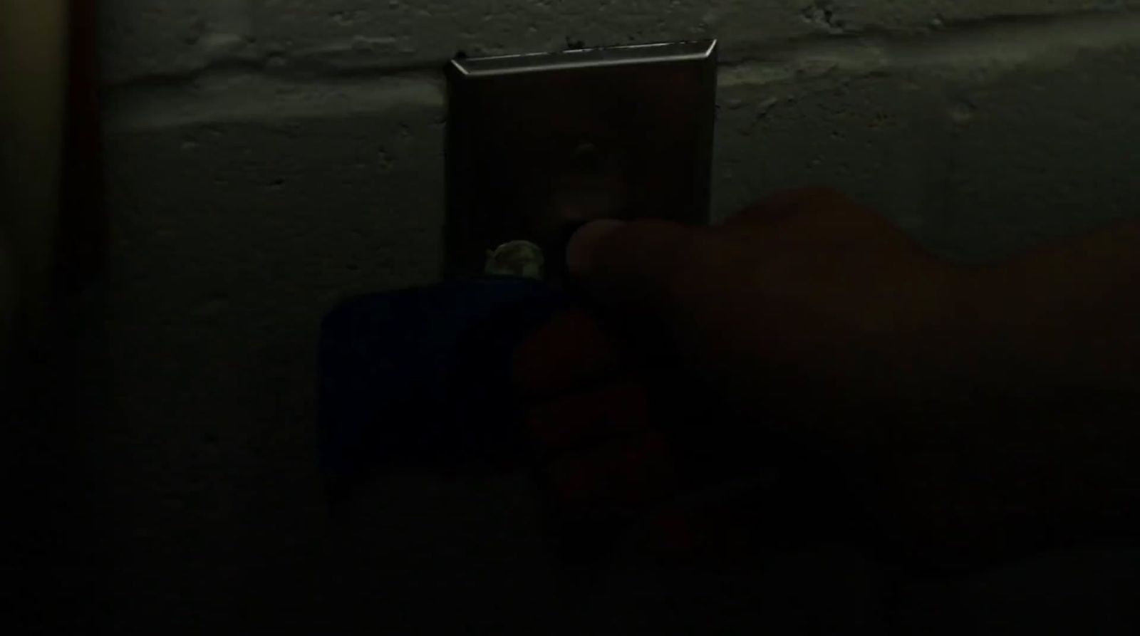 a person is holding a lighter in their hand