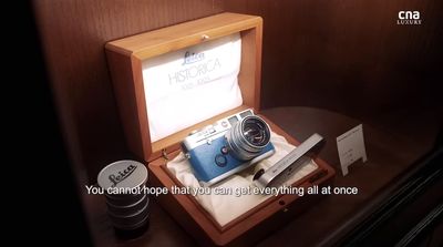 a wooden box with a camera inside of it