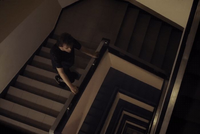 a woman walking down a flight of stairs