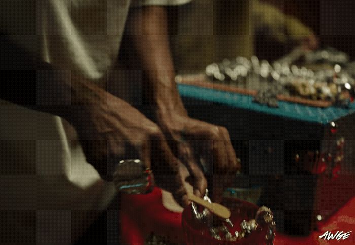 a close up of a person cutting a piece of cake