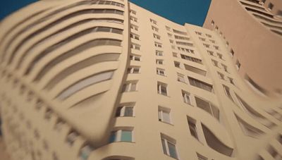 a very tall building with a sky background