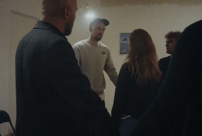 a group of people standing in a room