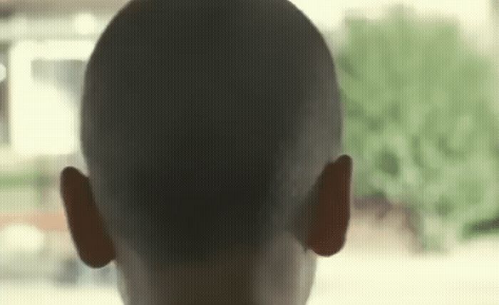 the back of a man's head in a blurry photo